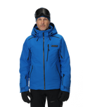 Man wearing a blue ski jacket with black accents on a white background