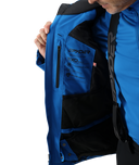 Close-up of a blue jacket with a brand logo on a white background