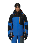 Person wearing a blue and black ski jacket with orange accents on a white background