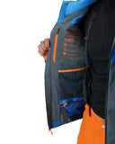 Close-up of a person wearing a blue, black, and orange jacket with visible branding on a white background.