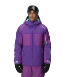 Person wearing a purple ski jacket and pants with a helmet on a white background