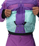 Purple and teal jacket with a focus on the front pocket design.
