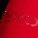 Close-up of a red surface with 'EXO' branding.