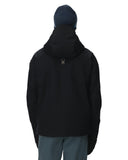 Person wearing a black jacket and blue beanie on a white background