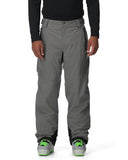 Person wearing gray pants with a black top on a white background