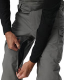 Person wearing gray pants with a close-up of the waistband on a white background