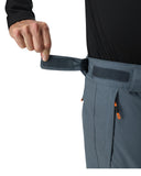 Person adjusting a strap on gray pants with a white background