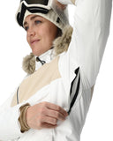 Person wearing a white and beige winter jacket with fur-lined hood
