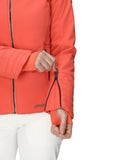 Person wearing an orange jacket with a brand logo on a white background