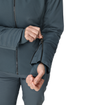 Person wearing a dark gray jacket with a zipper on a white background