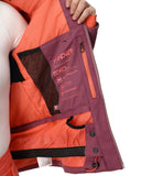 Close-up of a person wearing an orange and purple jacket with brand logo.