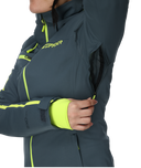 Person wearing a gray jacket with green accents, featuring Spyder branding.