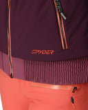 Close-up of a purple jacket with orange accents and Spyder logo.