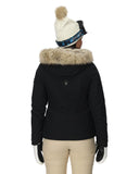 Person wearing a black jacket with fur hood, white beanie, and gloves on a white background