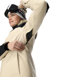 Person wearing a beige winter coat with black accents on a white background