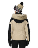 Person wearing a beige winter jacket with fur trim and a matching beanie on a white background