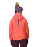 Person wearing a bright orange jacket and maroon pants on a white background