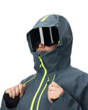 Person wearing a gray hooded jacket with neon accents and goggles on a white background