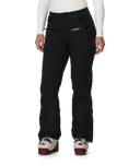 Black pants worn by a person on a white background