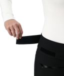 Person wearing a white shirt and black pants with a white background