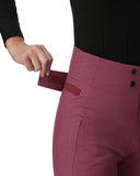 Person wearing pink pants with a black top, holding a red box.