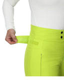 Close-up of bright green pants with a white shirt and black buttons.
