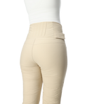 Beige pants worn by a person on a white background