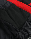 Close-up of a black and red jacket with mesh material.