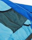 Close-up of a blue jacket with a mesh pocket and zipper