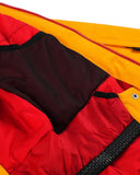 Close-up of a red and yellow jacket with a zipper