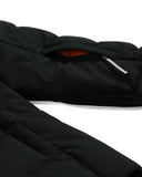 Close-up of a black jacket with a white background
