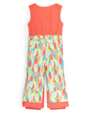 Colorful sleeveless top and patterned pants on a white background