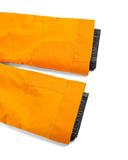 Two orange broom handles with black bristles on a white background