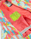Colorful jacket with a brand label on a multicolored background