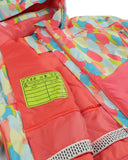 Colorful jacket with a 'Pass Me On' label on a multicolored background