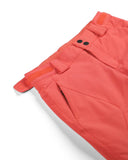 Close-up of orange shorts with a white background