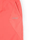 Close-up of a red jacket with a brand logo on a white background