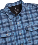 Blue plaid shirt with Spyder label on a white background