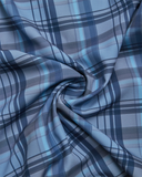 Blue and gray plaid fabric with a swirl pattern