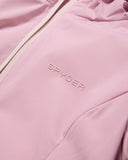 Close-up of a pink jacket with 'Spyder' branding.