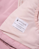 Close-up of a Spyder label on a pink jacket