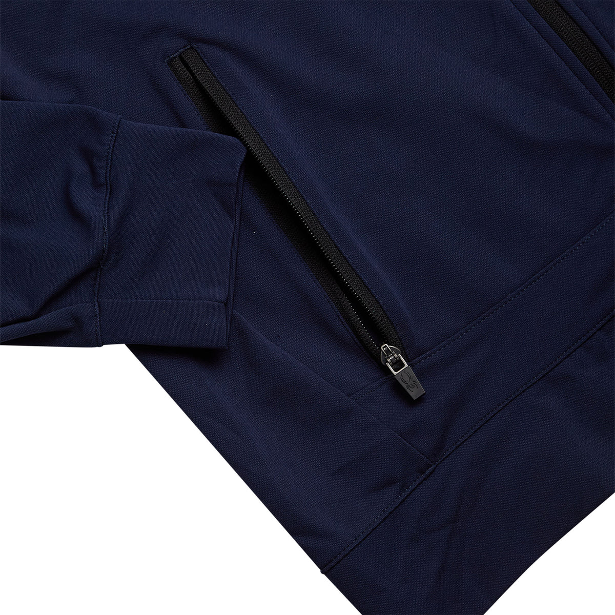 Close-up of a navy blue jacket with a zipper on a white background
