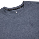 Close-up of a blue textured shirt with Spyder logo on collar and chest.